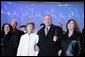 President George W. Bush and Laura Bush join holiday entertainers Thursday evening, Dec. 1, 2005, on stage during the Pageant of Peace and lighting of the National Christmas Tree festivities on the Ellipse in Washington. White House photo by Paul Morse