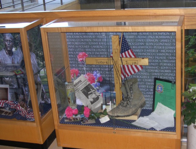 This display case, which is housed in the new “Veterans Hall,” contains the combat boots of Army staff sergeant, Robert S. Trujillo of Santa Fe. Trujillo died on the first day of his tour in Vietnam in 1968. The cross in the display was made by his friend and left at “The Wall That Heals” traveling replica when it was in Los Alamos in 2000. Trujillo’s sister left his combat boots at the wall.