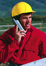 man with hard hat and cell phone