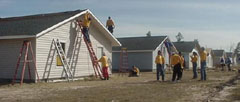 Habitat for Humanity volunteers construct new homes in the Wood Glen subdivision in Houston.