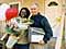 New homeowner Adrienne Dash in front of her new house with house sponsor Robert Francoli 