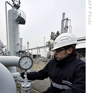 Worker checks manometer at EWE gas plant in northern German town of Nuettermoor, 09 Jan 2009 