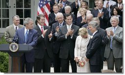 President George W. Bush, joined by Senate and House members, welcomes John and Reve Walsh prior to signing H.R. 4472, the Adam Walsh Child Protection and Safety Act of 2006 at a ceremony Thursday, July 27, 2006, in the Rose Garden at the White House. The bill is named for the Walsh’s six-year-old son Adam Walsh who was abducted and killed 25 years ago. White House photo by Paul Morse