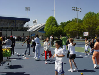 DEUCE participants put the program to work by getting limber (or stretching) on the tennis court