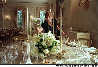 With just a few, short hours to go, Chief Florist Nancy Clarke makes sure a floral centerpiece consisting of Hydrangeas, White Lilies, White Roses and Limes is just right. White House photo by Tina Hager.