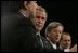 President George W. Bush stands with European Commission President Jose Manuel Barroso, left, European Union President Jean-Claude Juncker and European Union Council Secretariat Javier Solana, right, during a joint news conference Tuesday, Feb. 22, 2005, in Brussels.