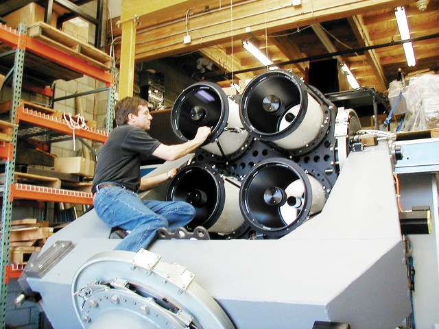 Laboratory contractor Alan Schier adjusts the alignment on the next generation RAPTOR rapid response telescope during fit checking and slew-speed acceptance testing. This telescope array, called RAPTOR-Technicolor, will be the world’s first system able to collect simultaneous “color cinematography” of the critical first few minutes of a gamma-ray burst.