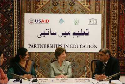 Mrs. Laura Bush addresses a roundtable discussion during an Education Through Partnerships meeting with representatives from USAID, UNESCO & CRI at library at the U.S. Embassy, Saturday, March 4, 2006 in Islamabad, Pakistan.