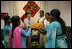 Mrs. Laura Bush is presented with gifts on her visit to an HIV/AIDS education prevention and treatment facility, Friday, March 3, 2006 at the Acharya N.G. Ranga Agricultural University in Hyderabad, India.