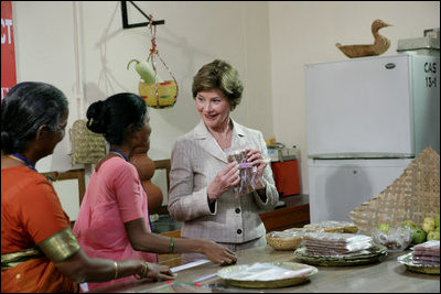 Mrs. Laura Bush visits a Home Science School Lab, Friday, March 3, 2006 at the Acharya N.G. Ranga Agricultural University in Hyderabad, India, viewing a demonstration on making guava cheese.