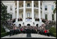 President George W. Bush and Mrs. Laura Bush pose for a photo Saturday evening, March 29, 2008 on the South Portico of the White House, with Mrs. Bush's classmates from the Midland High School graduating class of 1964, during their class reunion gathering at the White House. White House photo by Chris Greenberg