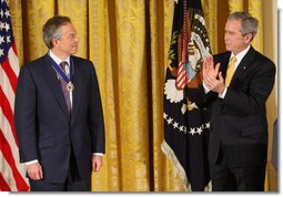 President George W. Bush applauds former Prime Minister Tony Blair after presenting him Tuesday, Jan. 13, 2009, with the 2009 Presidential Medal of Freedom during ceremonies in the East Room of the White House. White House photo by Chris Greenberg