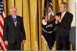 President George W. Bush applauds former Prime Minister John Howard after presenting the Australian leader with the 2009 Presidential Medal of Freedom during ceremonies Tuesday, Jan.13, 2009, in the East Room of the White House. White House photo by Chris Greenberg