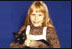 Amy Carter, daughter of Jimmy Carter (1977-81), holds her Siamese cat, Misty Malarky Ying Yang. 