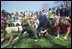 Children scramble to the finish line at the 1971 Easter Egg Roll on the South Lawn of the White House. The White House lawn became the "official" home of the egg roll when President and Mrs. Hayes offered their backyard in 1878.