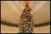 The Official 2004 Christmas tree stands in the center of the Blue Room. The Christmas tree this year is an 18-foot Noble fir. The tree was donated by John and Carol Tillman of Rochester, Wash.