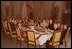 President and Mrs. Eisenhower are all smiles as they host a 1960 Christmas Party in the State Dining Room.