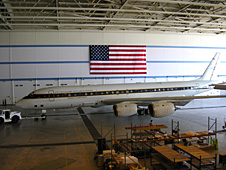 The American flag is displayed above the DC-8 Flying Laboratory during pre-deployment activities at the Dryden Aircraft Operations Facility in Palmdale, Calif.