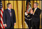 President George W. Bush applauds former Prime Minister Tony Blair after presenting him Tuesday, Jan. 13, 2009, with the 2009 Presidential Medal of Freedom during ceremonies in the East Room of the White House. White House photo by Chris Greenberg