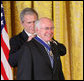 Former Prime Minister John Howard of Australia, smiles as President George W. Bush presents him with the 2009 Presidential Medal of Freedom Tuesday, Jan. 13, 2009, during ceremonies in the East Room of the White House. Established in 1963, the Medal may be presented to "any person who has made an especially meritorious contribution to the security or national interests of the United States, or world peace or cultural or other significant public or private endeavors." White House photo by Chris Greenberg