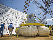NASA engineers prepare to lift the Orion test article for a drop test