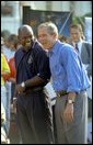 President George W. Bush takes in the excitement of the White House Fitness Expo on the South Lawn with Dallas Cowboys Running Back Emmitt Smith June 20.  