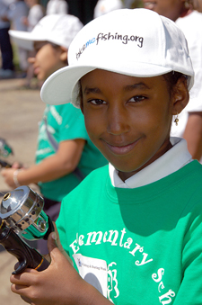 Photograph:  Little girl poses with her fishing pole and new "take me fising.org" hat.