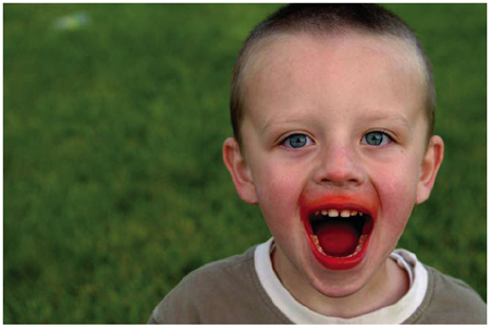 child with food-stained mouth