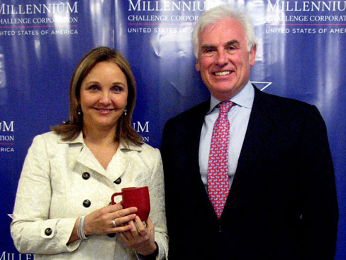 MCC CEO Ambassador John Danilovich and World Food Program Executive Director Josette Sheeran, pictured here with a small red cup Sheeran brought from Africa is an actual portion size of the only food that some children in school food programs throughout the world receive on a daily basis.