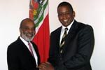 (left to right) Haitian President René Préval and Congressman Kendrick Meek meet on Monday, April 21 in Port-au-Prince, Haiti.