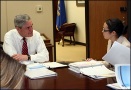 FBI Director Robert Mueller meeting with his intelligence briefer.