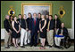 President George W. Bush stands with members of the University of Alaska-Fairbanks Men's and Women's Rifle Championship Team Friday, Sept. 21, 2007, at the White House during a photo opportunity with the 2006 and 2007 NCAA Sports Champions. White House photo by Chris Greenberg