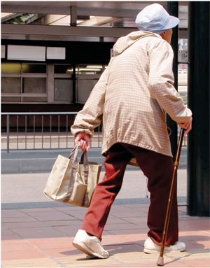 older person with cane