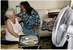 woman caring for elderly woman
