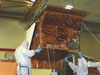 Workers install the Troposphereic Emission Spectrometer