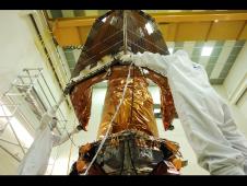 Engineers at Ball Aerospace install the Solar Array Assembly of the Kepler spacecraft.