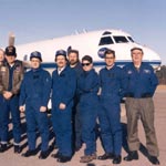 Helen Worden and team in front of a plane