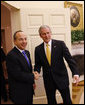 President George W. Bush greets Mexico's President Felipe Calderon for their meeting Tuesday, Jan. 13, 2009, in the Oval Office at the White House. White House photo by Eric Draper
