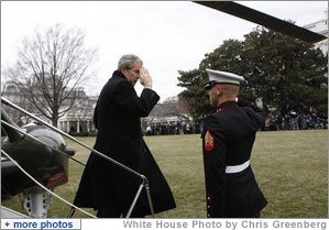 President George W. Bush salutes a U.S. Marine crew member of Marine One upon his return to the White House Sunday, Jan. 18, 2009 from Camp David, which marks President Bush's final return to the South Lawn of the White House aboard the Presidential helicopter as President. White House photo by Chris Greenberg