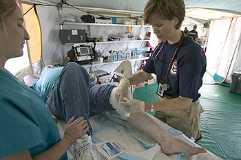 Oklahoma Disaster Medical team member Jodi Elderton assists hurricane Ivan victim Kathy Steenland as friend stands by. FEMA photo/Andrea Booher