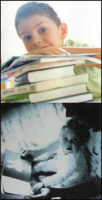 boy looking over pile of books