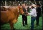 President George W. Bush greets a participant at the Houston Livestock Show and Rodeo Monday, March 8, 2004.  White House photo by Eric Draper