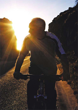 man biking in the sun