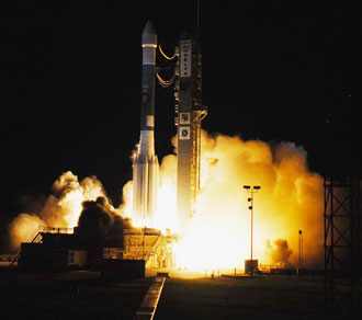 Delta II rocket lifts off the launch pad.