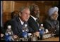 President George W. Bush, UN Secretary General Kofi Annan, center, and Prime Minister Manmohan Singh of India, far right, attend the meeting of the International Launch of the United Nations Democracy Fund in New York Wednesday, Sept. 14, 2005. White House photo by Eric Draper