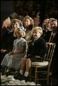 Jack and Josie Roberts look on as their father, John G. Roberts Jr., takes the Oath of Office as the 17th Chief Justice of the United States during ceremonies Thursday, Sept. 29, 2005, at the White House. White House photo by Eric Draper