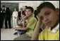 Laura Bush joins students in watching a kids educational program at the Discovery School of Swaifiyeh Secondary School in Amman, Jordan, Sunday, May 22, 2005. White House photo by Krisanne Johnson