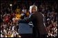 Welcomed by a crowd of more than 4000 people, President George W. Bush addresses the cheering audience at Northern State University in Aberdeen, S.D., Oct. 31. White House photo by Tina Hager.