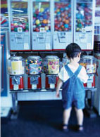 toddler in front of vending machines