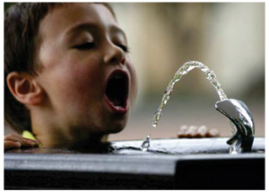 kid at waterfountain